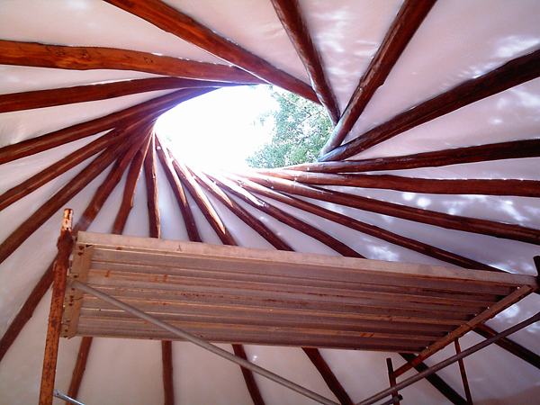 Reciprocal roof during assembly showing rafter placement sequence